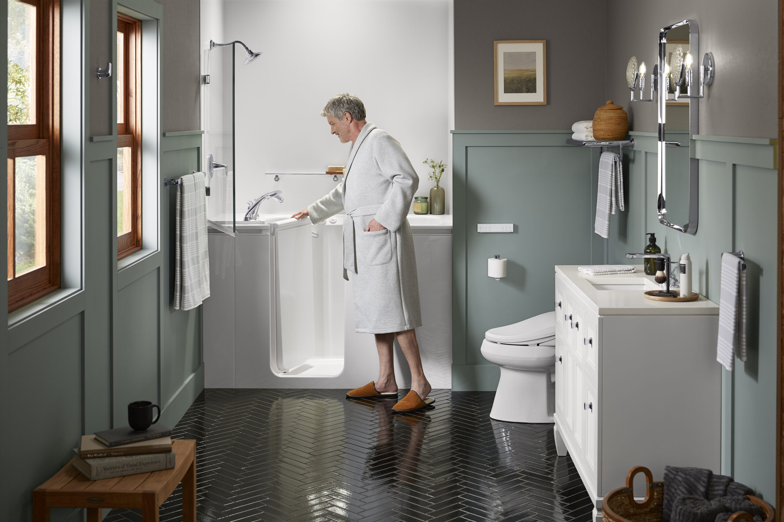 A man wearing a white rob opening the door to a walk-in bathtub