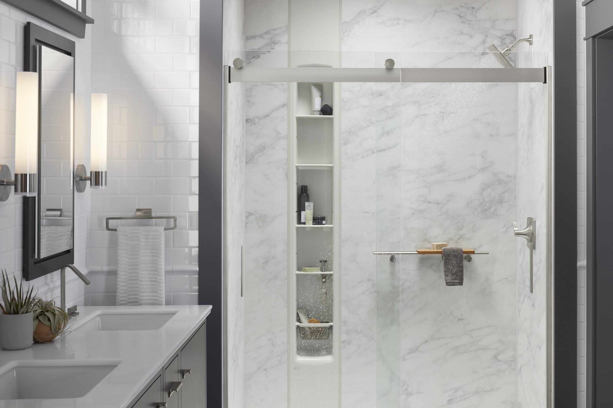 Glass shower enclosure with built-in shelving