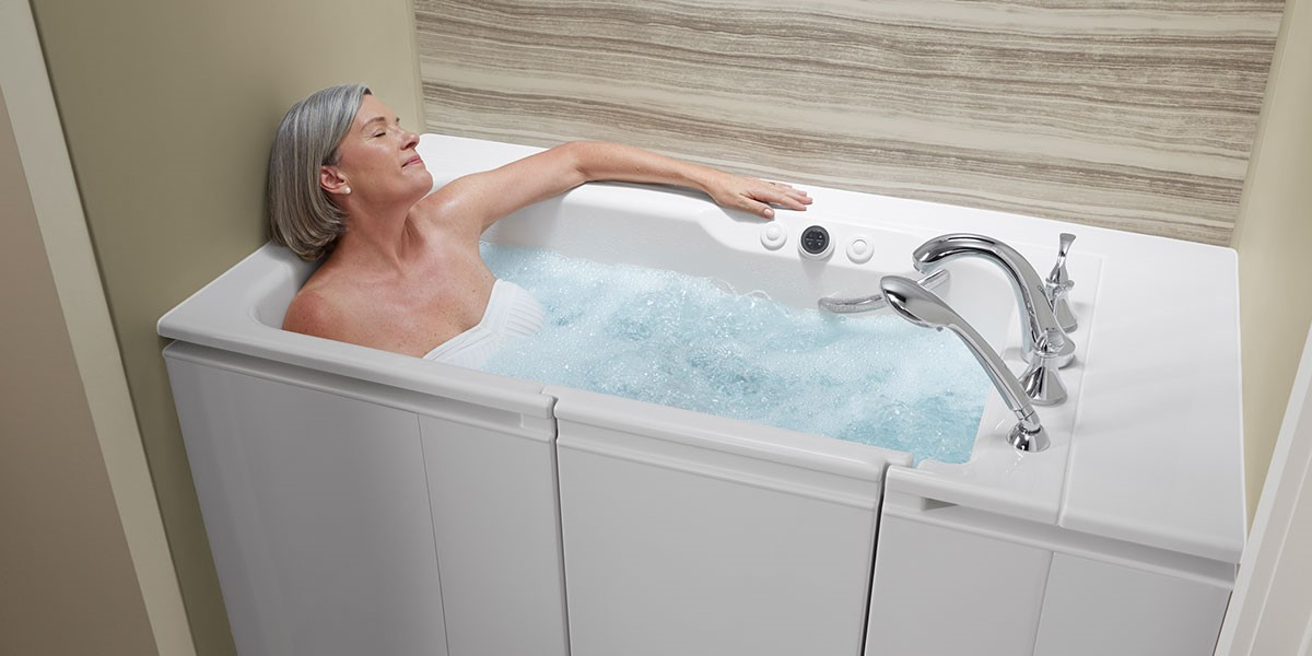 An older women relaxing in a bathtub