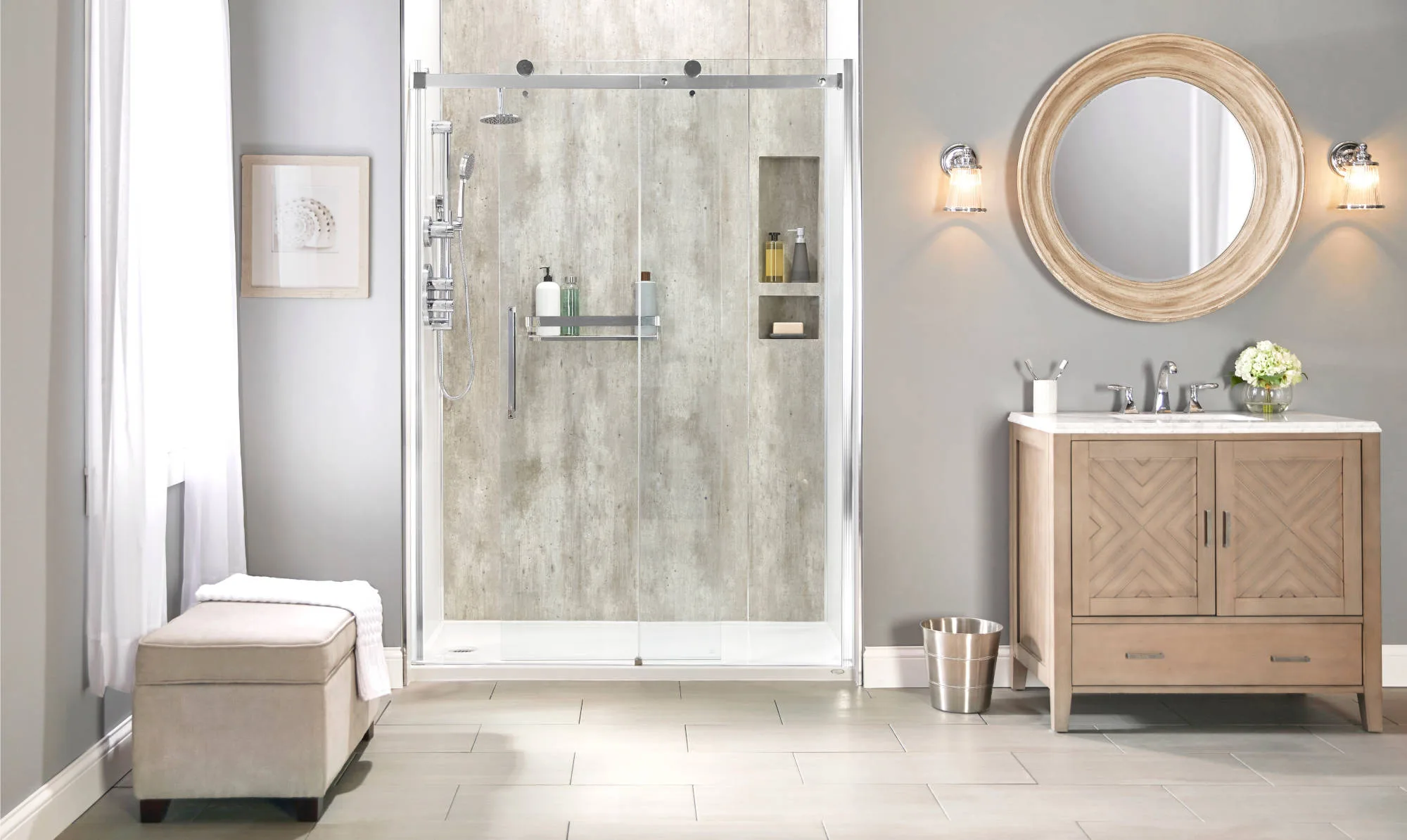 Modern bathroom with walk-in shower featuring sliding glass doors, built-in shelves, and wood vanity