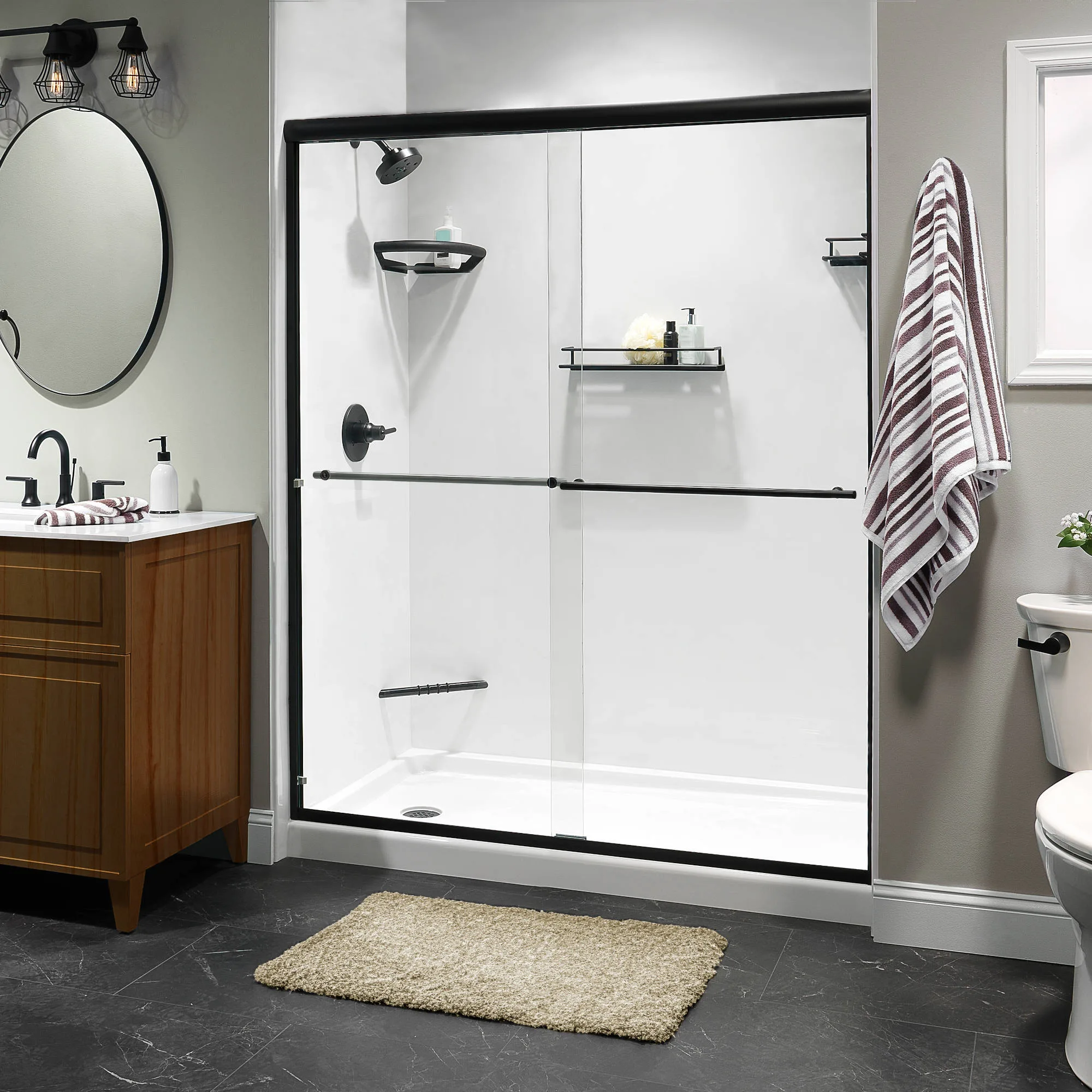 White walk-in shower with black-framed glass doors and wood vanity