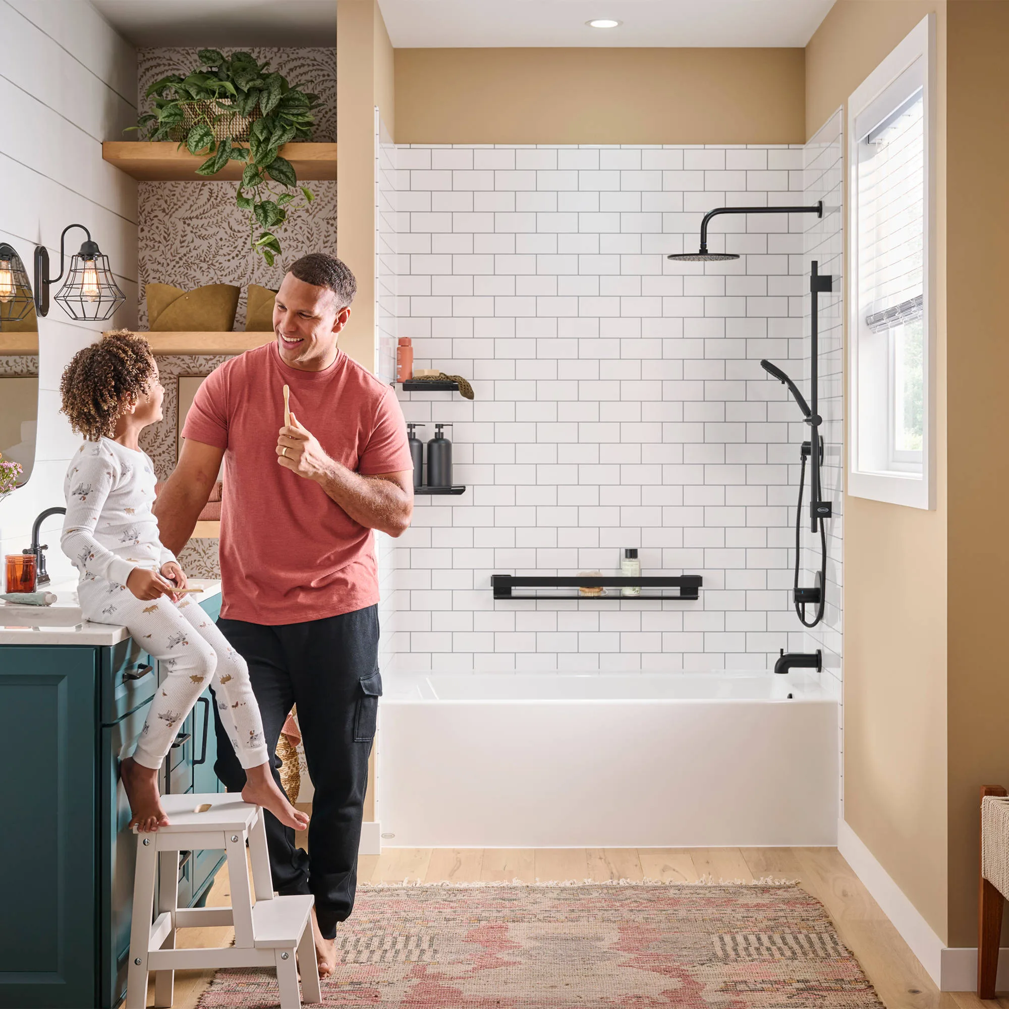 Father and child beside white subway-tile tub and shower